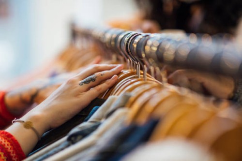 woman looking through clothing - fashion stock pictures, royalty-free photos & images