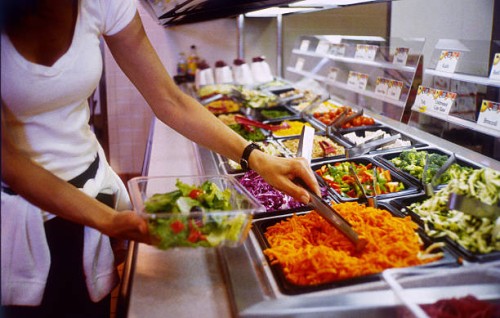 woman making a salad - junk food stock pictures, royalty-free photos & images