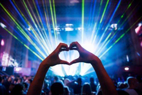 woman making heart shape with hands at music event - concert stock pictures, royalty-free photos & images
