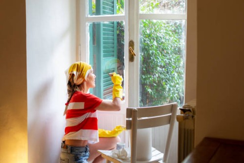 woman painting window frames - home decoration stock pictures, royalty-free photos & images