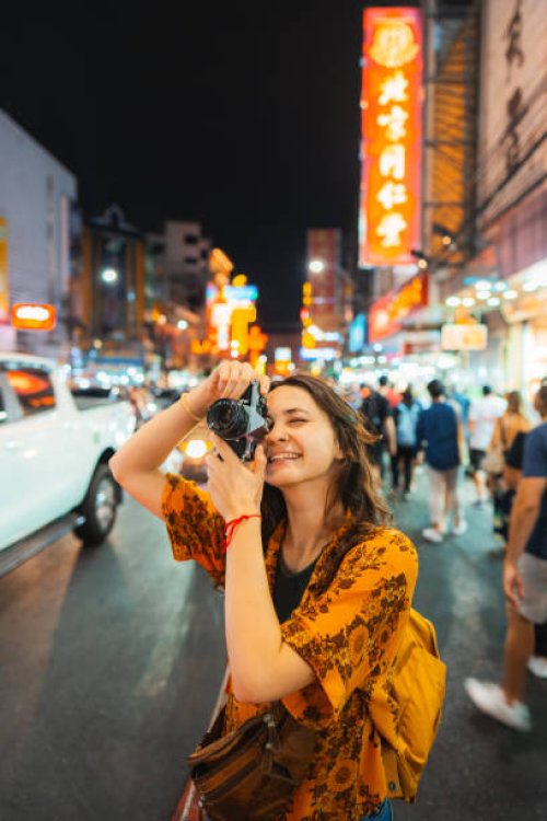 woman photographing with camera in chinatown, bangkok - travel stock pictures, royalty-free photos & images