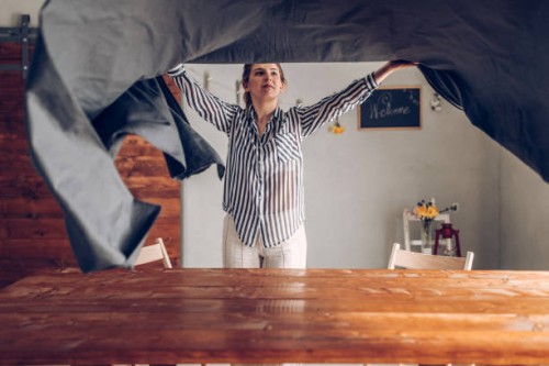 woman preparing dinner table - home decoration stock pictures, royalty-free photos & images