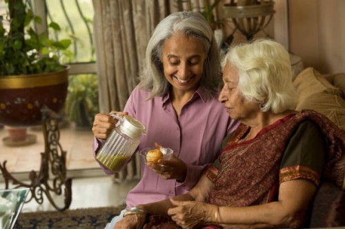 woman preparing pani puri for her old friend - junk food stock pictures, royalty-free photos & images