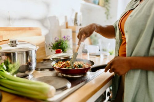 woman preparing quinoa vegetable mix cooked in a frying pan - food stock pictures, royalty-free photos & images