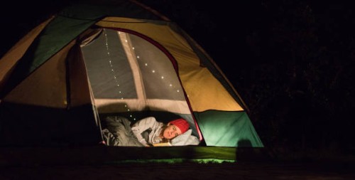 woman reading at night in tent - garden decoration stock pictures, royalty-free photos & images