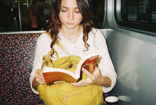 woman reading book in subway - fashion stock pictures, royalty-free photos & images