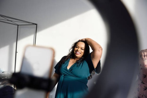 woman recording herself dancing on her phone - fashion stock pictures, royalty-free photos & images