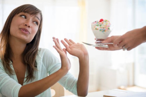 woman refusing unhealthy ice cream - junk food stock pictures, royalty-free photos & images