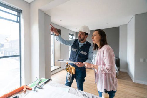 woman remodeling her house and talking to the architect - home decoration stock pictures, royalty-free photos & images