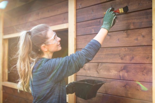woman repairing a garden house - home decoration stock pictures, royalty-free photos & images