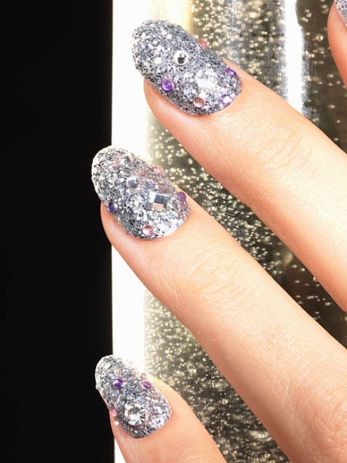 woman's finger with nail art - nails art stock pictures, royalty-free photos & images