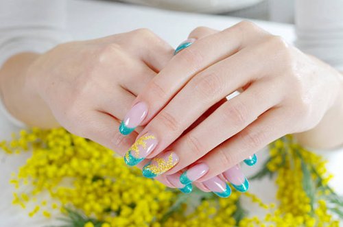 woman's hands with floral nail art design - nails art stock pictures, royalty-free photos & images