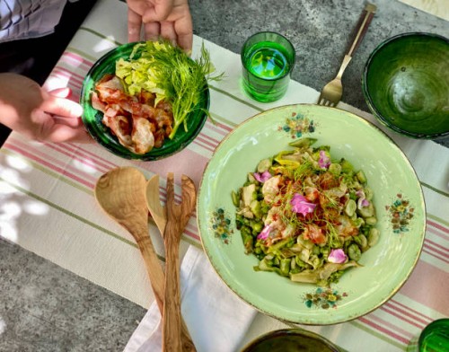woman serving vignarola, a traditional roman springtime dish - food stock pictures, royalty-free photos & images