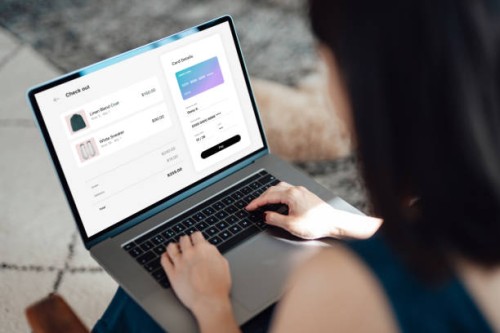 woman shopping clothes online on laptop and making payment with credit card - fashion stock pictures, royalty-free photos & images