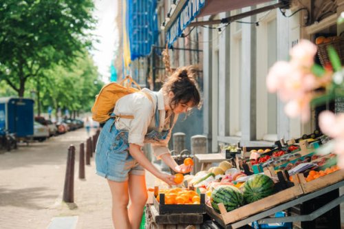 woman shopping for fruits in small shop in amsterdam - food stock pictures, royalty-free photos & images