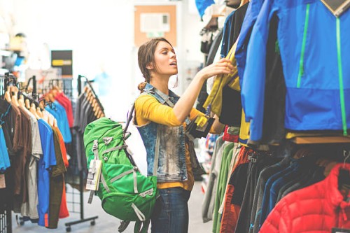 woman shopping in outdoor equipment mega store - fashion stock pictures, royalty-free photos & images