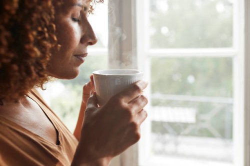 woman smelling coffee - coffee stock pictures, royalty-free photos & images