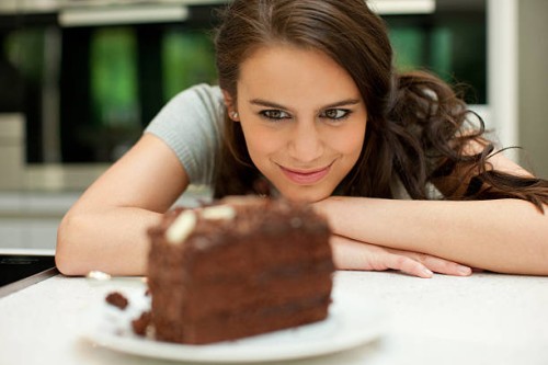 woman staring at chocolate cake - food stock pictures, royalty-free photos & images