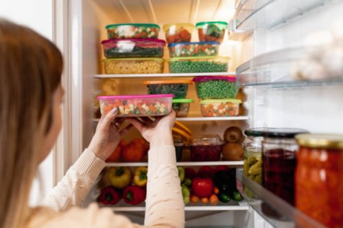 woman taking raw food from refrigerator - food stock pictures, royalty-free photos & images