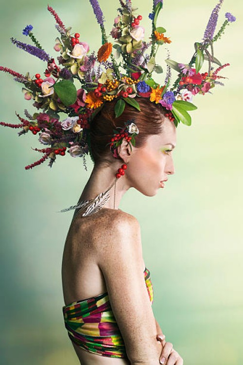 woman wearing a colorful floral mohawk - fashion stock pictures, royalty-free photos & images