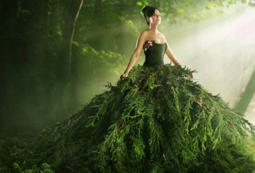 woman wearing a large green gown in the forest - fashion stock pictures, royalty-free photos & images