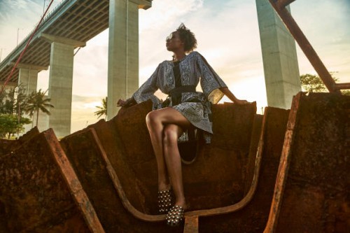 woman wearing dress and sitting on rusty ship wreck - fashion stock pictures, royalty-free photos & images