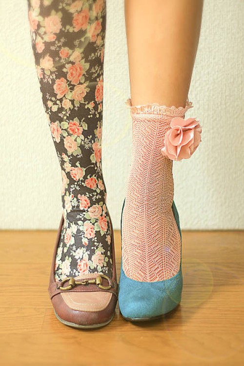 woman wears different socks on each leg - fashion stock pictures, royalty-free photos & images