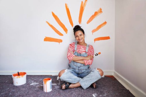 woman with brush strokes on wall renovating home - home decoration stock pictures, royalty-free photos & images