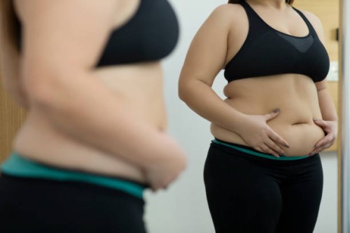 woman with fat abdomen - junk food stock pictures, royalty-free photos & images
