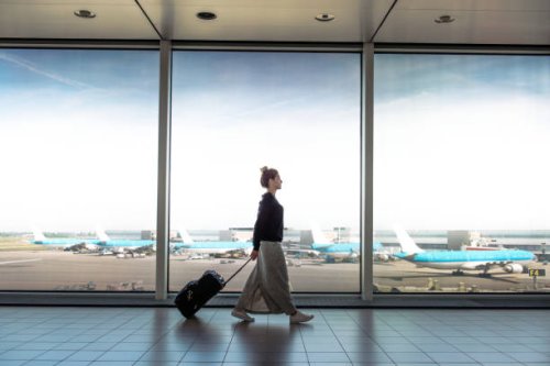 woman with suitcase is going to board on the next flight - travel stock pictures, royalty-free photos & images