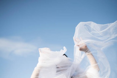 woman with white veil blowing over face - fashion stock pictures, royalty-free photos & images