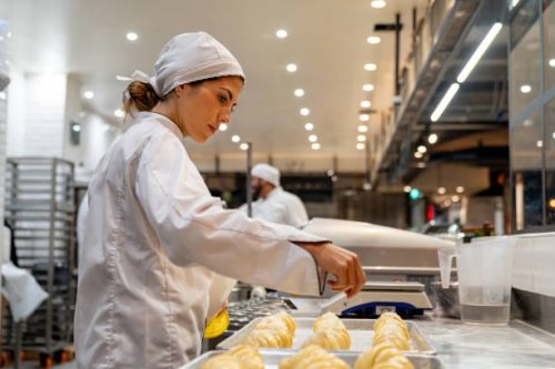 woman working at a bakery making croissants - food stock pictures, royalty-free photos & images