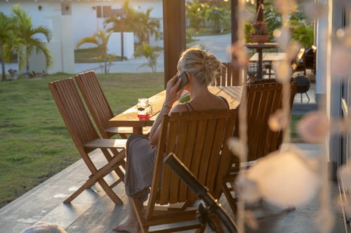 woman works from home on outdoor patio in the morning - garden decoration stock pictures, royalty-free photos & images