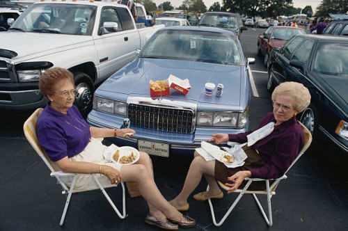 women eating at tailgate party - junk food stock pictures, royalty-free photos & images