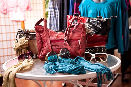 women's fashion accessories in retail store window display. purses, clothes. - fashion stock pictures, royalty-free photos & images