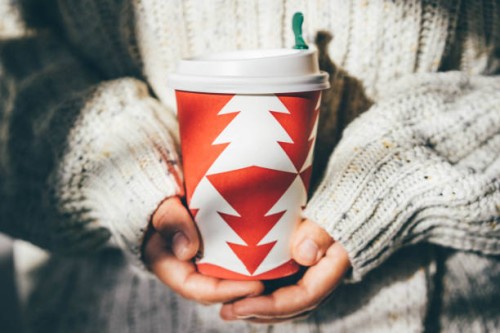women's hands in a cozy sweater holding a cup of coffee to go. - junk food stock pictures, royalty-free photos & images