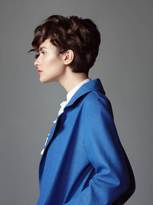 wont in blue coat - hairstyle stock pictures, royalty-free photos & images