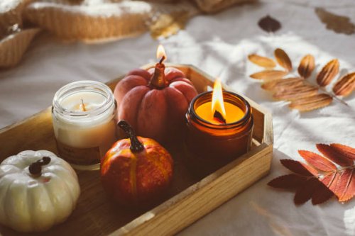 wooden tray with atmospheric candles and aututmn fall leaves on white bed. - home decoration stock pictures, royalty-free photos & images