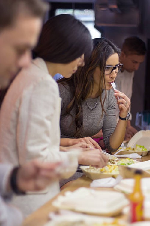 work colleagues on lunch break - junk food stock pictures, royalty-free photos & images
