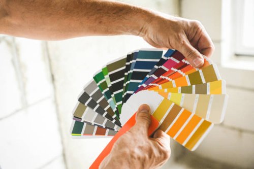 worker doing renovations in an apartment, color swatch, - home decoration stock pictures, royalty-free photos & images