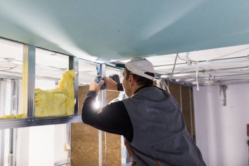 worker is fixing the drywall - home decoration stock pictures, royalty-free photos & images