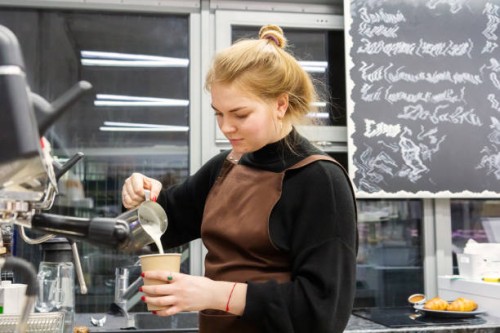 working in a cafe at night - young waitress preparing coffee in the cafeteria - junk food stock pictures, royalty-free photos & images
