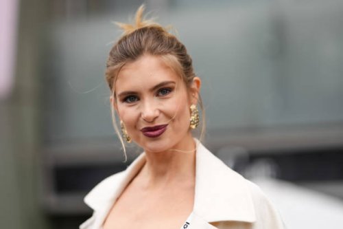 Xenia Adonts wears gold earrings, white tank Gucci top, outside Gucci, during the Milan Fashion week Men’s Fall/Winter 2025-2026 on February 25, 2025...