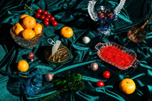 xmas modern dinner table setting on green velvet fabric background. creative merry christmas celebration concept. contemporary new year festive backdrop - food stock pictures, royalty-free photos & images