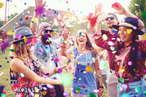 young adult friends throwing confetti at festival - concert stock pictures, royalty-free photos & images
