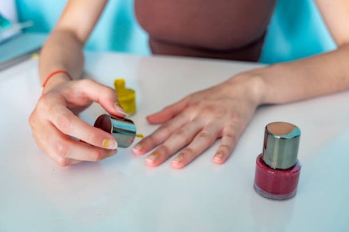 young adult painting her nails at home with nail polish - nails art stock pictures, royalty-free photos & images