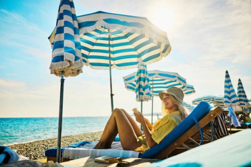 young adult woman relaxing at a luxury hotel on holiday in the côte d'azur, france. - travel stock pictures, royalty-free photos & images