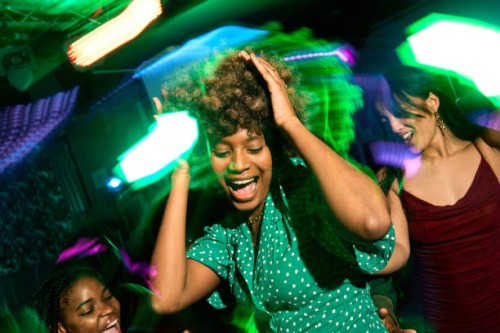 young afro american woman dancing and having fun at the disco with her friends - concert stock pictures, royalty-free photos & images