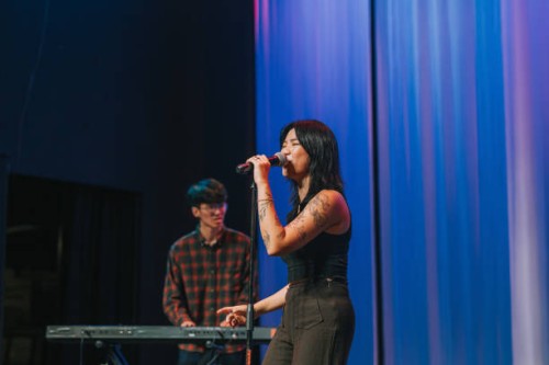 young asian chinese female lead singer and keyboard player live band group performance on stage - concert stock pictures, royalty-free photos & images