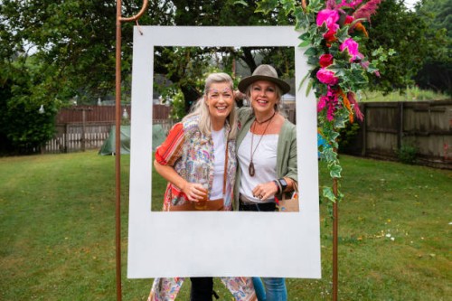 young at heart festival goers - garden decoration stock pictures, royalty-free photos & images